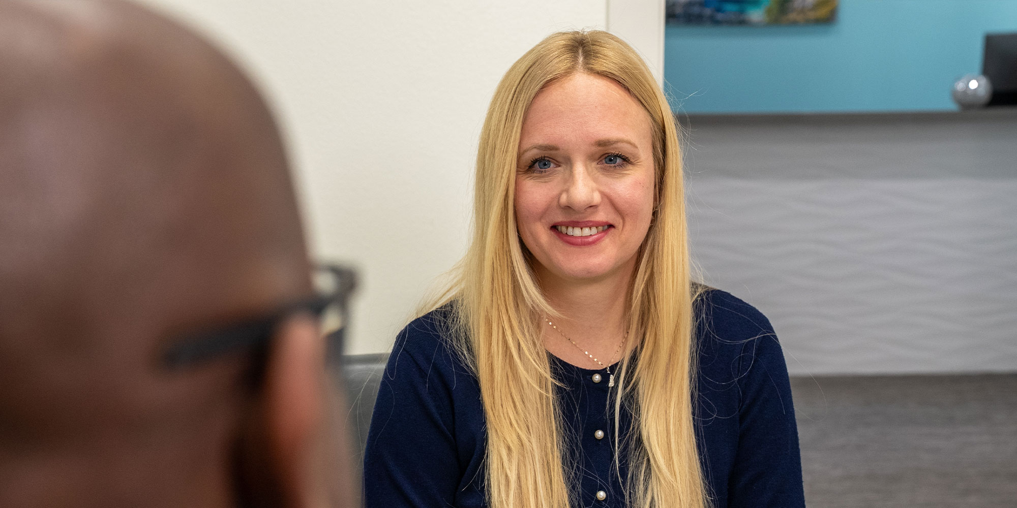 lady with blonde hair learning about pricing